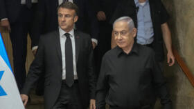 French President Emmanuel Macron and Israeli Prime Minister Binyamin Netanyahu arrive for a joint press conference in Jerusalem on October 24, 2023. 