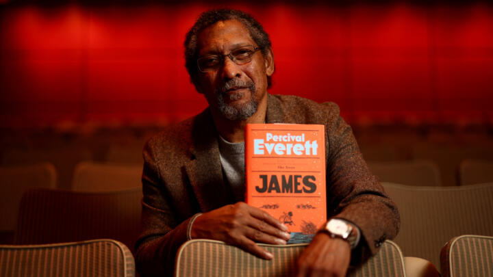 US writer and Booker Prize 2024 shortlisted author Percival Everett poses with a copy of his book "James" during the Booker Prize 2024 Award photo call event at the Southbank centre, central London, November 11, 2024.
