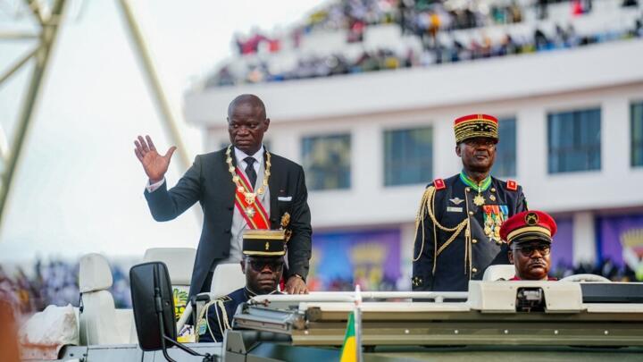 Gabon's President Brice Oligui Nguema waves to the crowd during his swearing-in ceremony at a stadium in Libreville on May 3, 2025. 