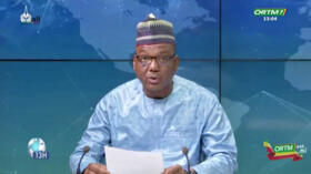 A video grab showing ORTM journalist Sidiki Youssouf Dembele reading a statement announcing Mali’s suspension of political parties during a live broadcast from Bamako on May 7, 2025.