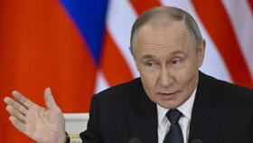 Russian President Vladimir Putin speaks during a joint media statement with Malaysia's Prime Minister following their talks at the Kremlin in Moscow on May 14, 2025. 