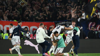 Bologna players celebrate winning the Italian Cup