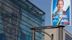 An election poster of candidate and co-leader of Germany's far-right Alternative for Germany (AfD) party Alice Weidel (R) is seen in front of the headquarters of the Christian Democratic CDU party with a picture of the CDU's candidate and leader Friedrich Merz on its facade, Berlin, February 24, 2025.