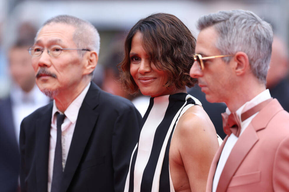 Berry stands between fellow jury members Hong Sang-Soo from South Korea and US actor Jeremy Strong.