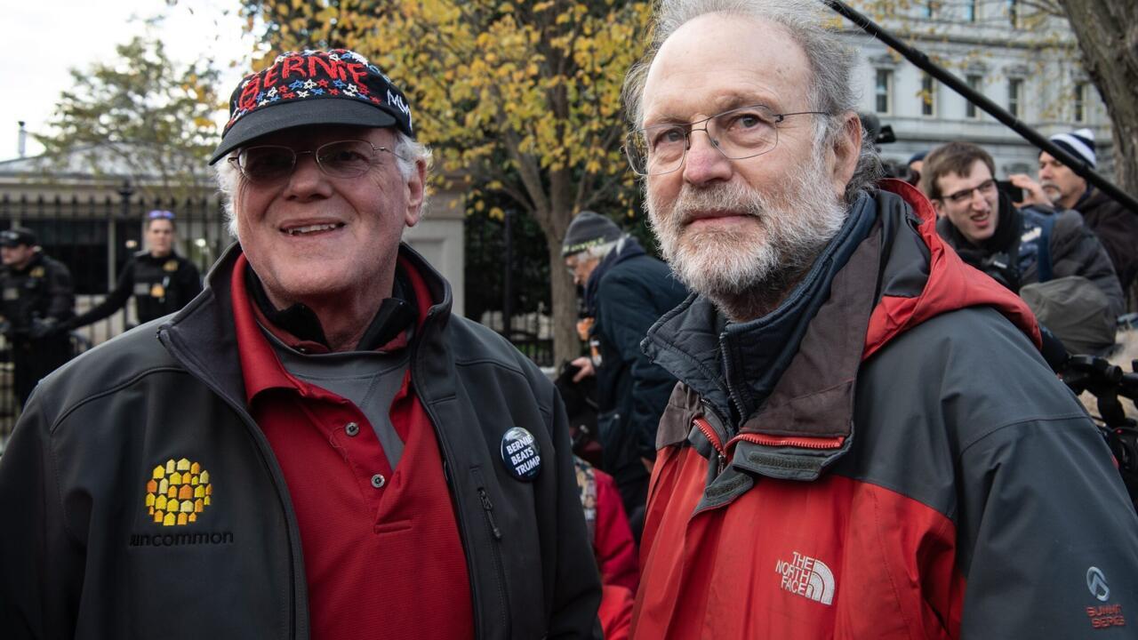 Ben Cohen (L) and Jerry Greenfield, the founders of Ben and Jerry's ice cream, stand outside the White House during a climate rally in Washington, DC on November 8, 2019