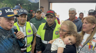 Venezuelan First lady Cilia Flores (R) welcomed home a toddler whose Venezuelan parents were deported from the United States without her