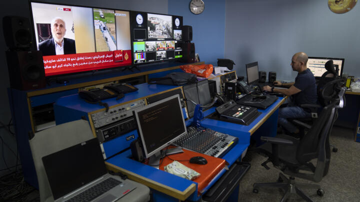 Al Jazeera broadcast engineer Mohammad Salameh works at the Master Control Room unit inside the network's office in the West Bank city of Ramallah on May 5, 2024.