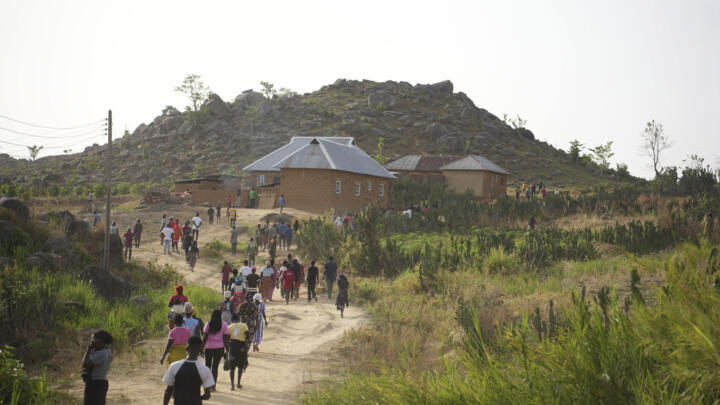 People prepare for the funeral of a man that was killed following an attack by gunmen in the Zike farming community in north-central Nigeria, Tuesday, April 15, 2025. 