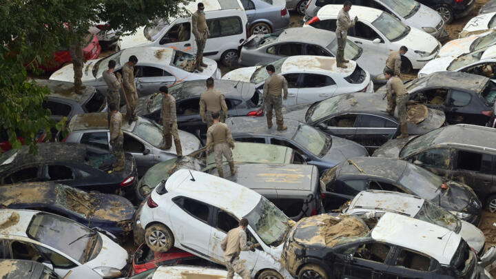 Soldiers search wrecked cars after flooding in Valencia, Spain, on November 8, 2024.