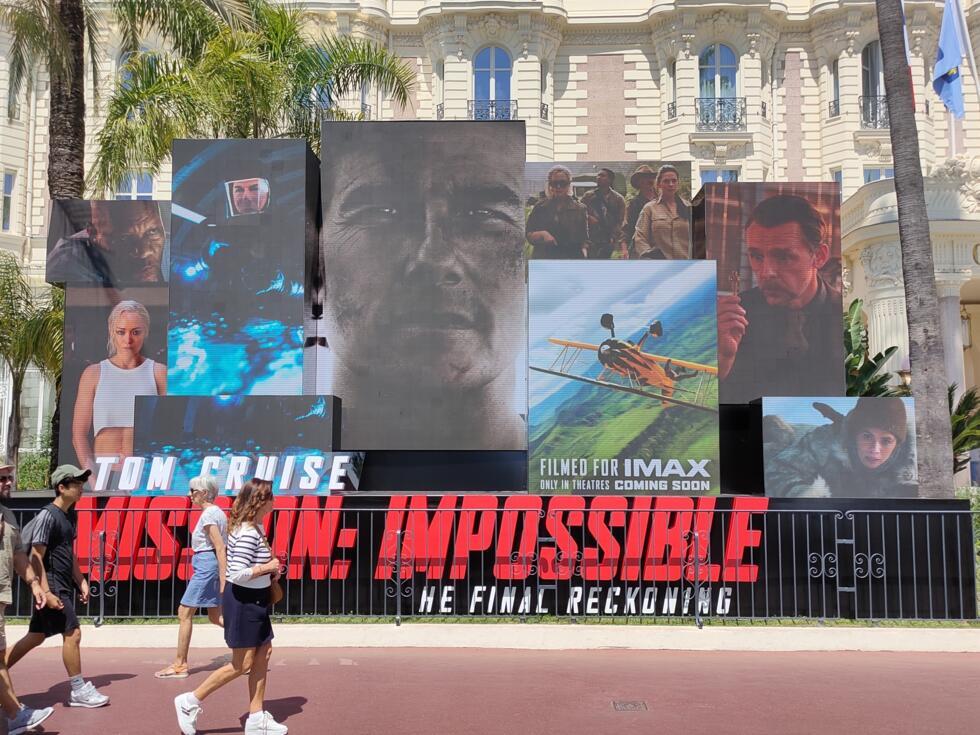 Screens promoting the latest "Mission: Impossible" film outside the iconic Carlton Hotel in Cannes.