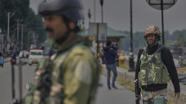 Indian soldiers stand guard after loud explosions were heard in Srinagar in Indian-controlled Kashmir on May 10, 2025.