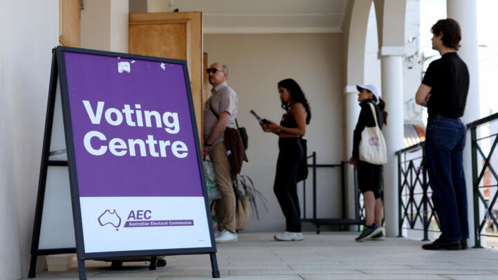 People queue outside a voting centre during the Australian federal election, in Sydney, Australia, May 3, 2025. 