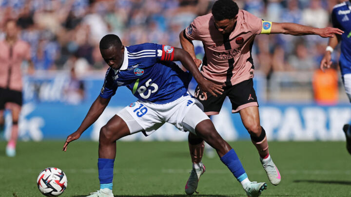 RC Strasbourg's Habib Diarra in action with Paris St Germain's Warren Zaire-Emery at Stade de la Meinau, Strasbourg, on May 3, 2025.