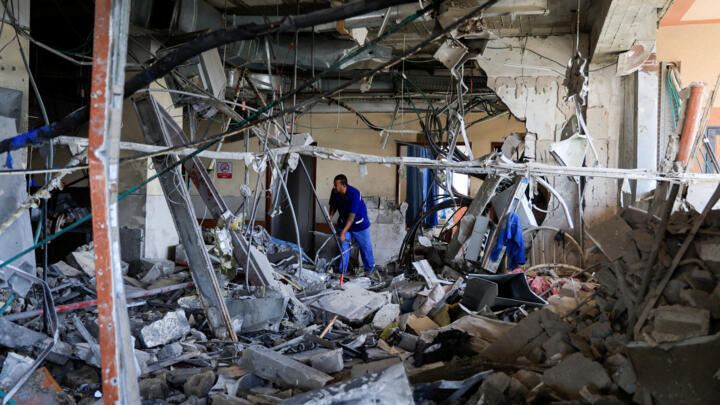 A person inspects Nasser Hospital a part of which was damaged in the aftermath of an Israeli strike, according to Gaza officials.